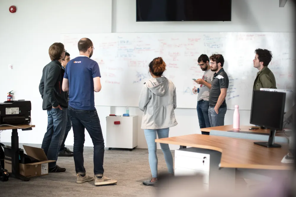 Ahrefs team collaborating in their office