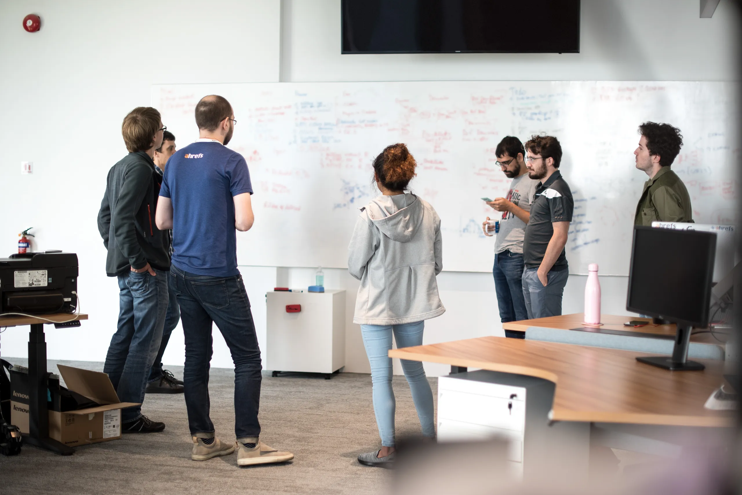 Ahrefs team collaborating in their office